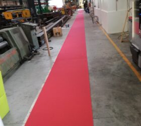 Passatoia in "agugliato" (pelo raso) colore rosso, (Fornitura e posa percorso aziendale clientela)